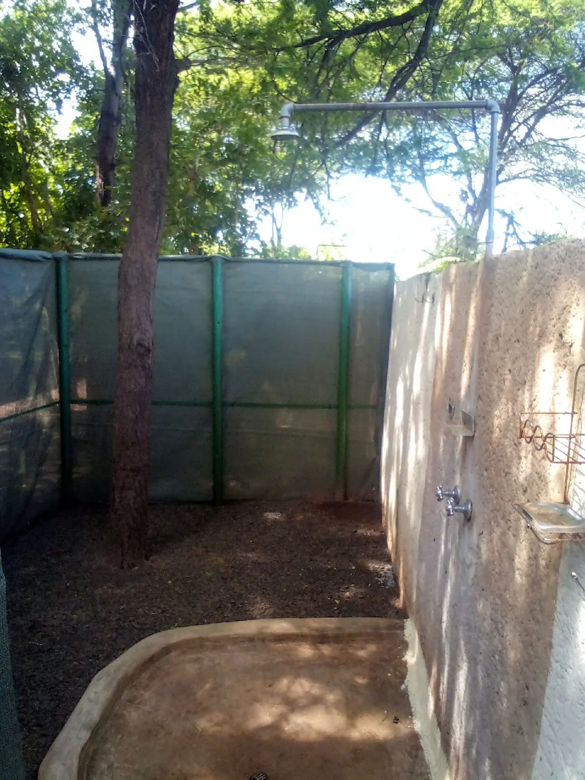 Outdoor shower with a screen