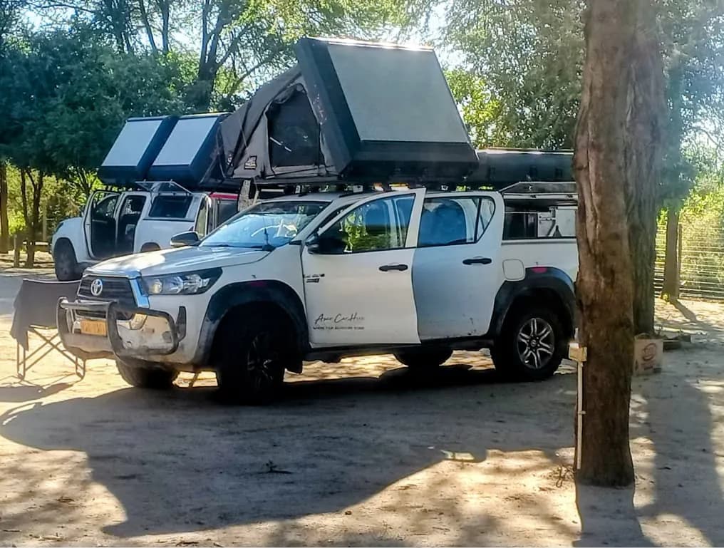 Two pickups with rooftop tents on the campsite