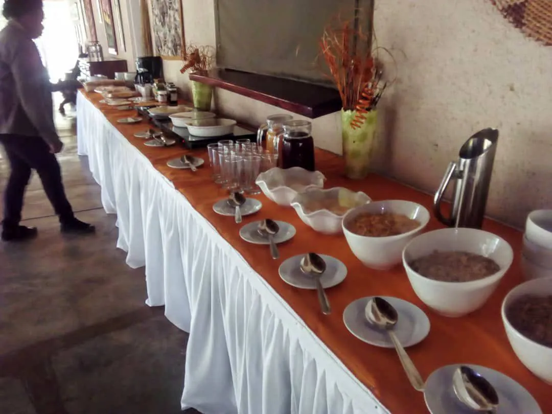 Breakfast buffet laid out along a long table