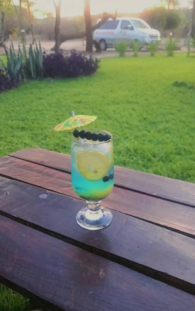 Blue cocktail on a garden table