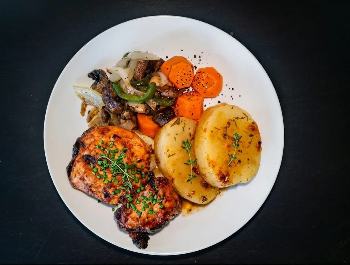 Grilled chicken with roast potatoes and carrots