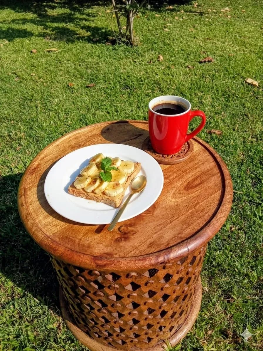 Toast and a mug of coffee on a carved table in the garden