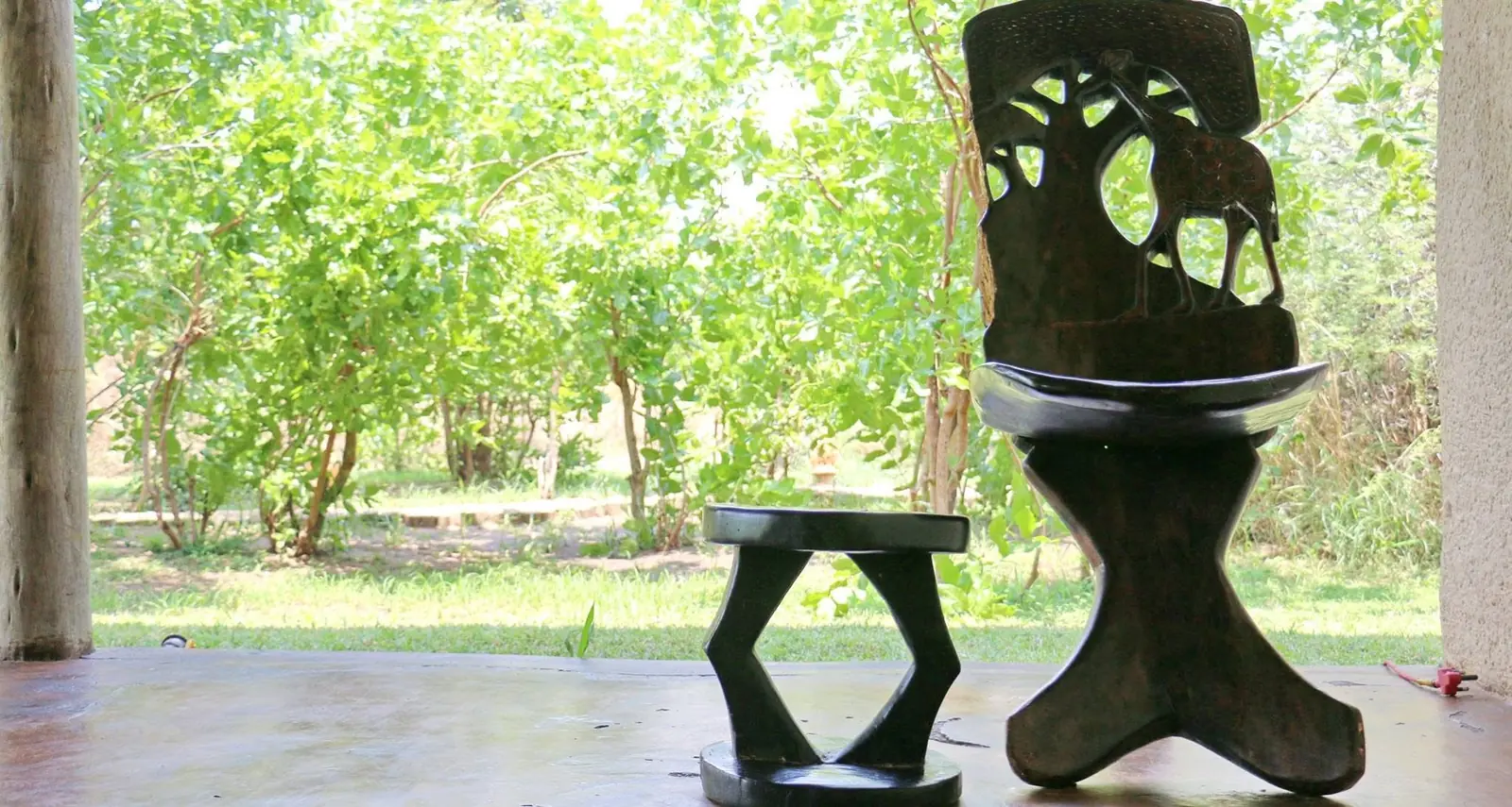 Carved wooden stool and sculpture