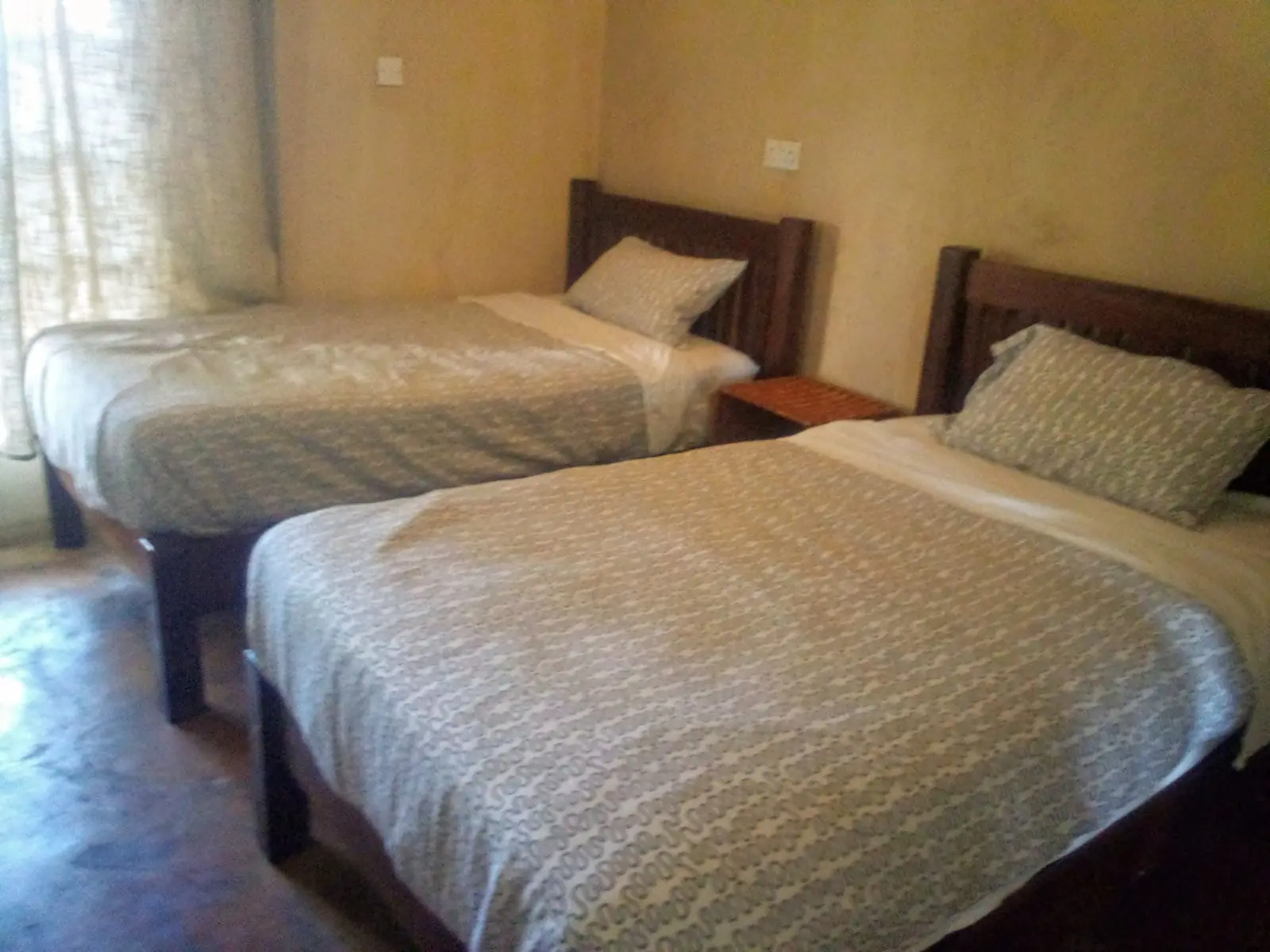 Twin room with cream bedspreads