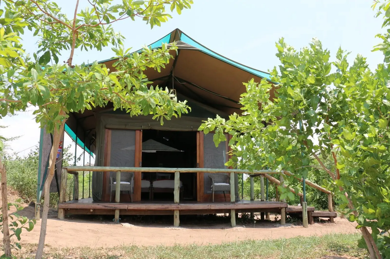 Tented chalet raised on a wooden deck