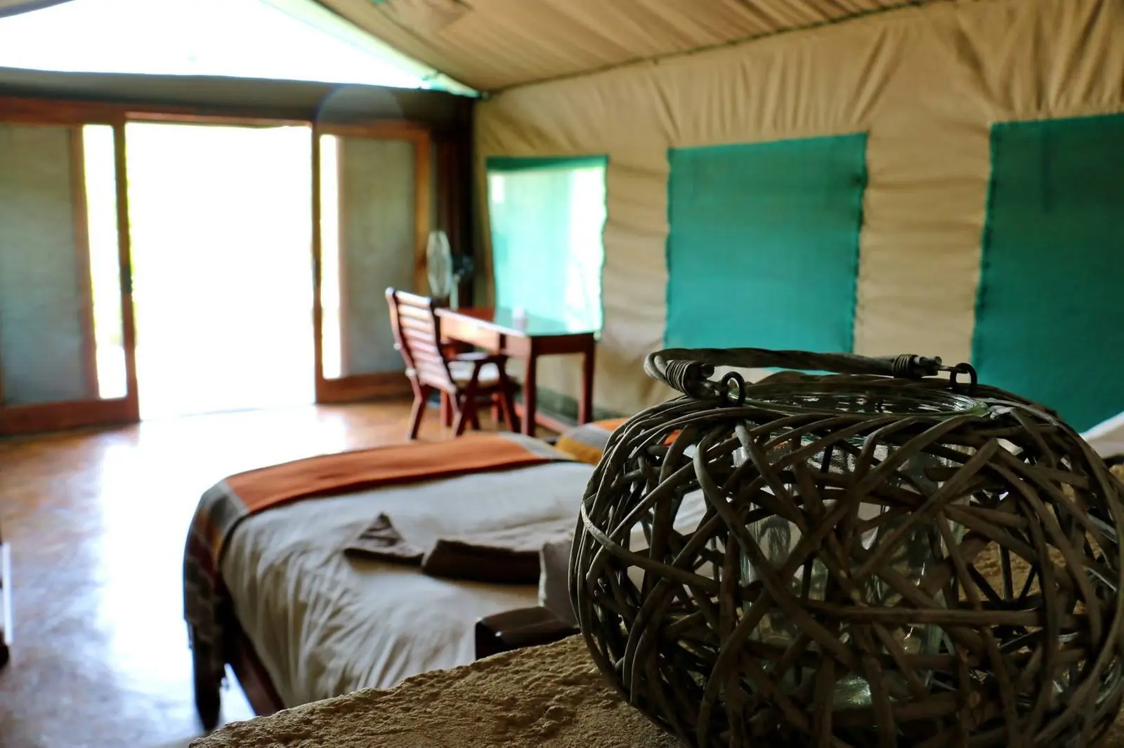 Tented chalet bedroom with a woven basket