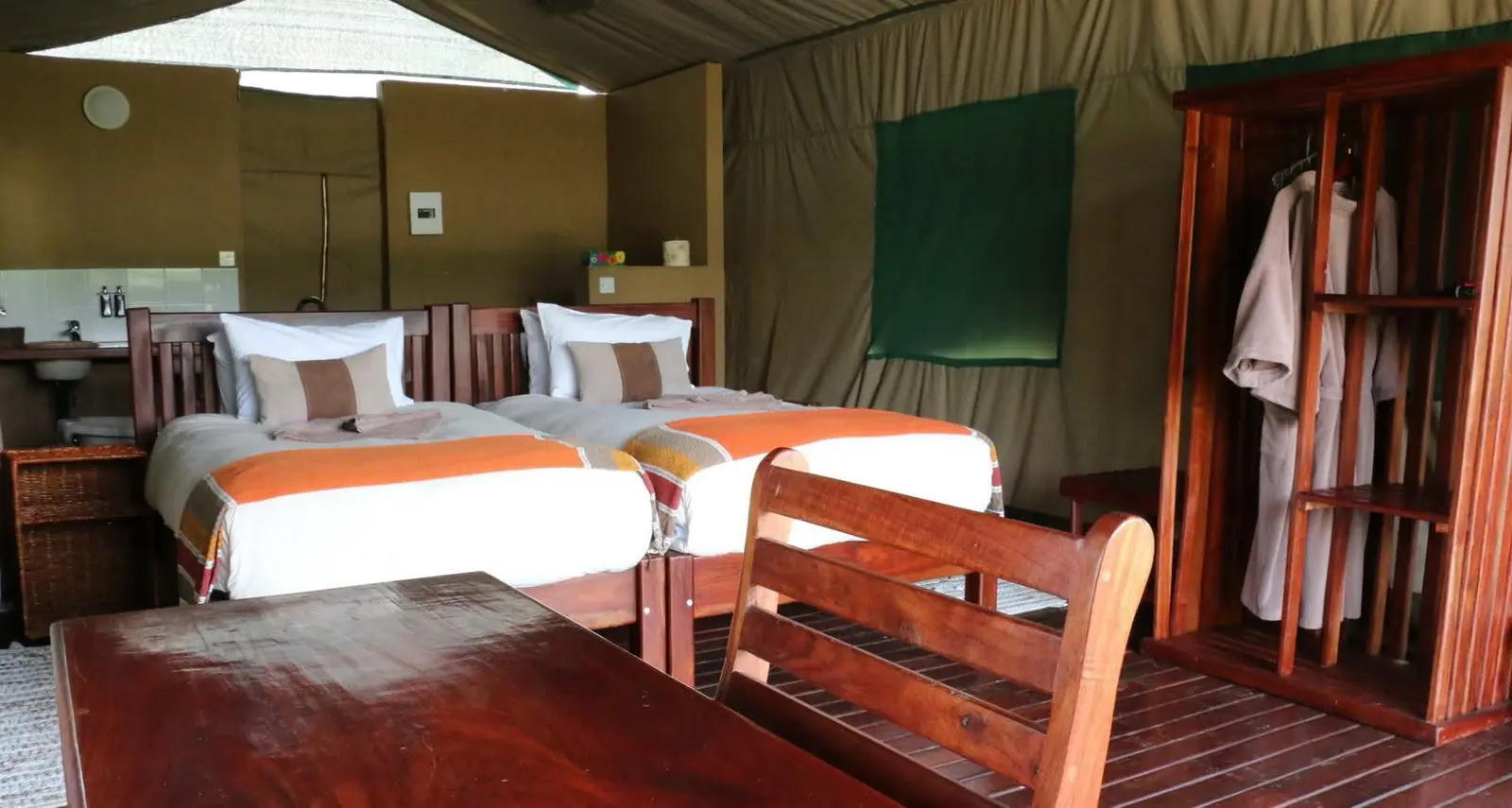 Tented chalet with twin beds, robes and wardrobe