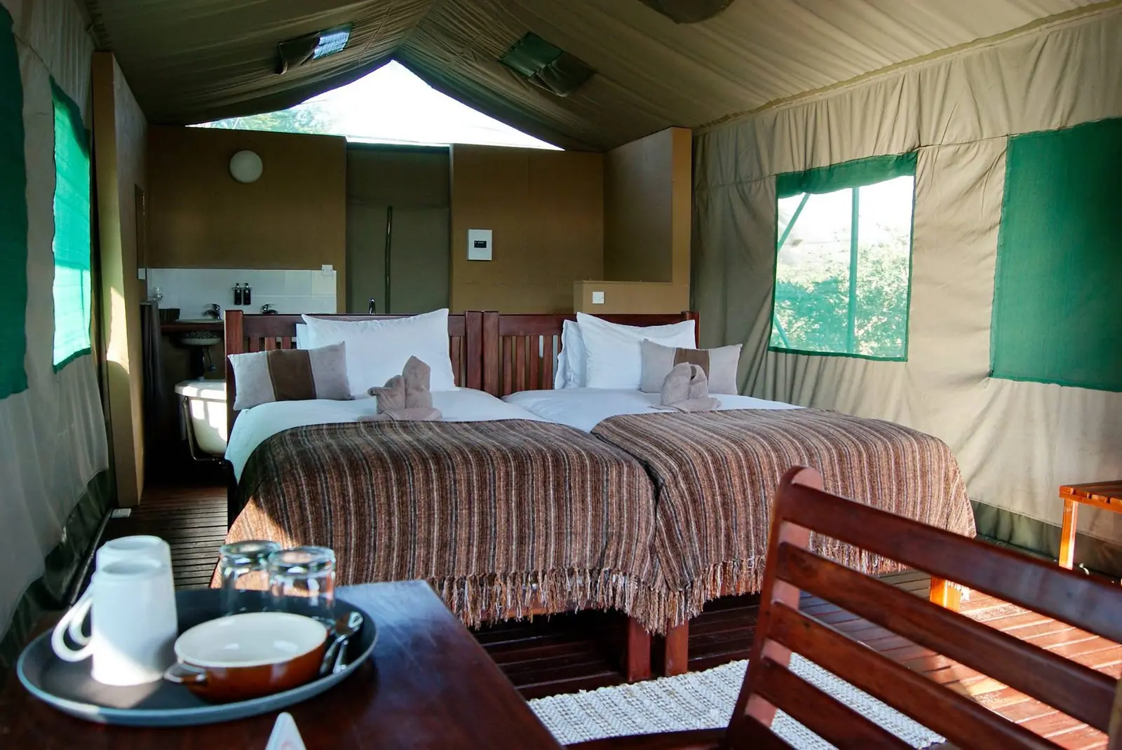 Tented chalet with twin beds and a tea tray