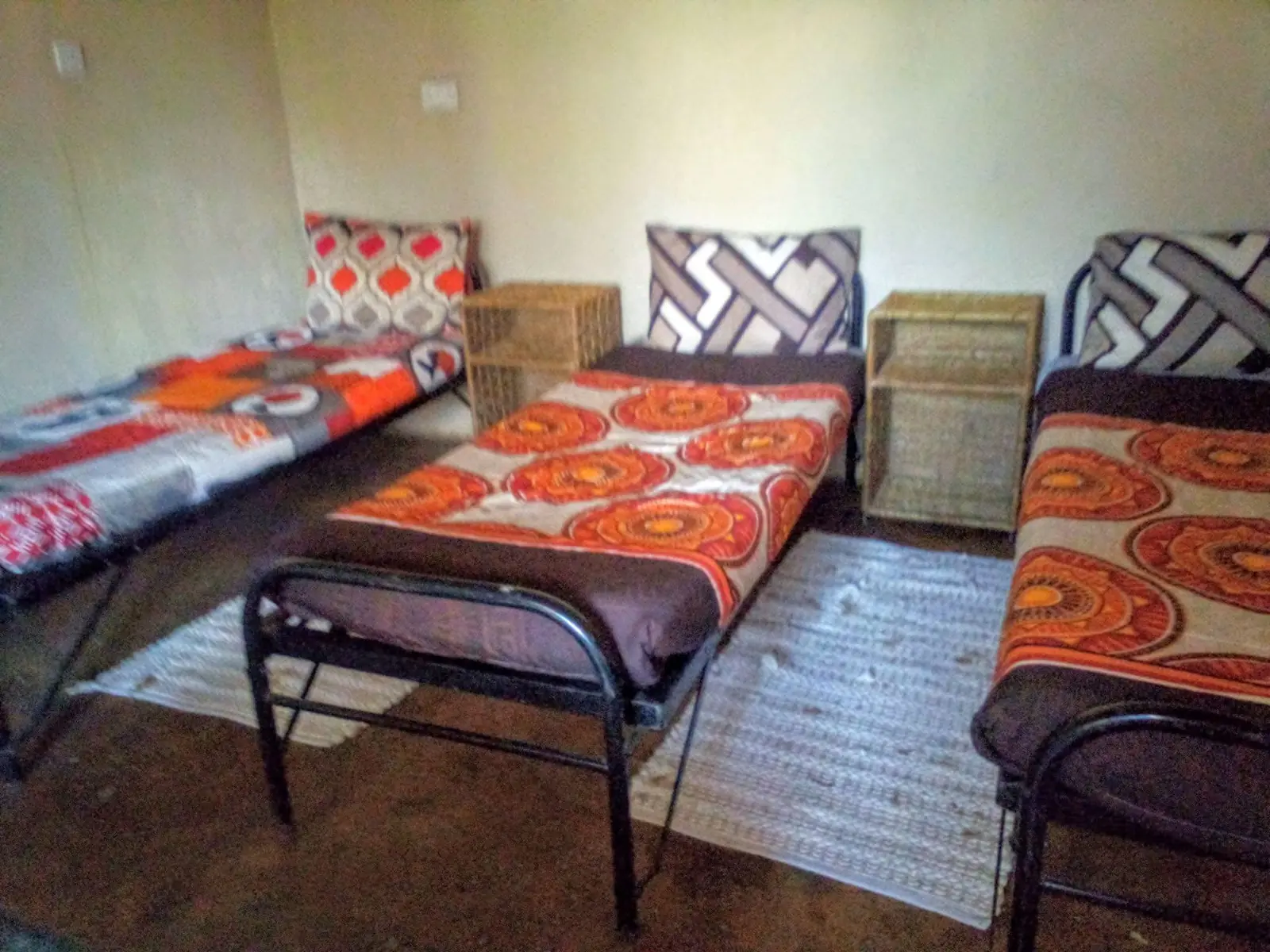 Dormitory beds with orange covers