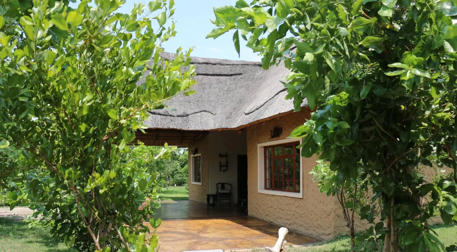 Front of a thatched lodge building