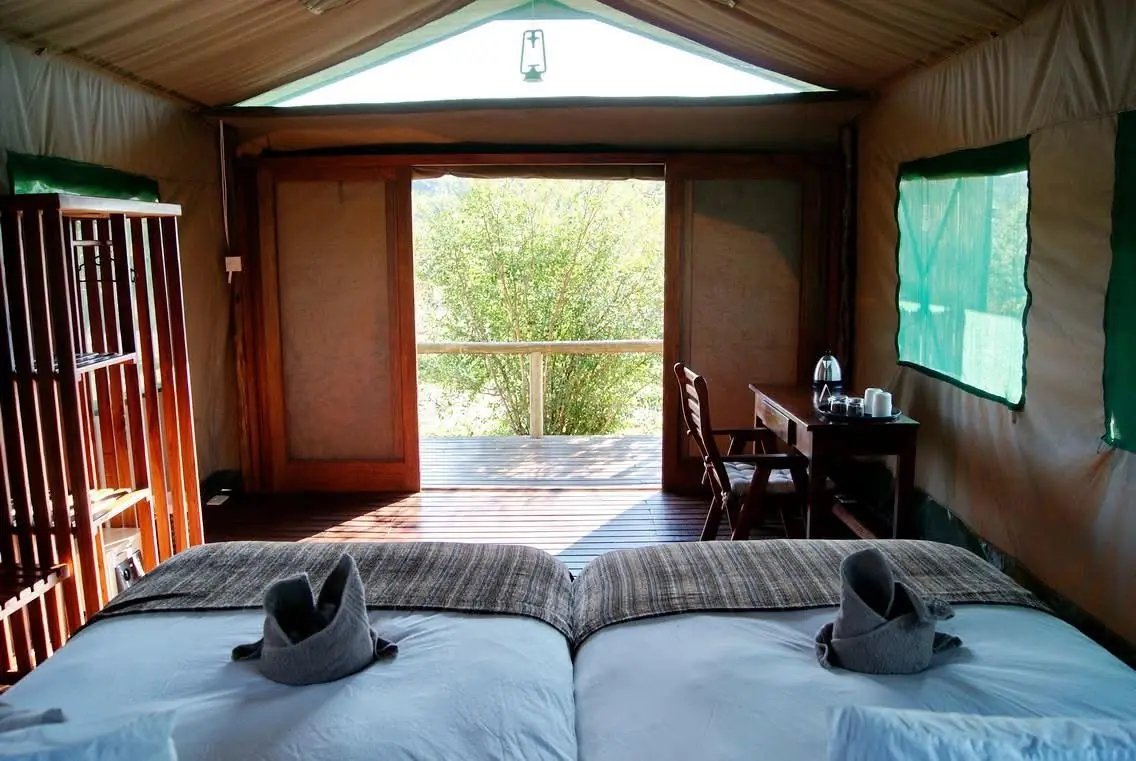 Tented chalet looking out through the doors